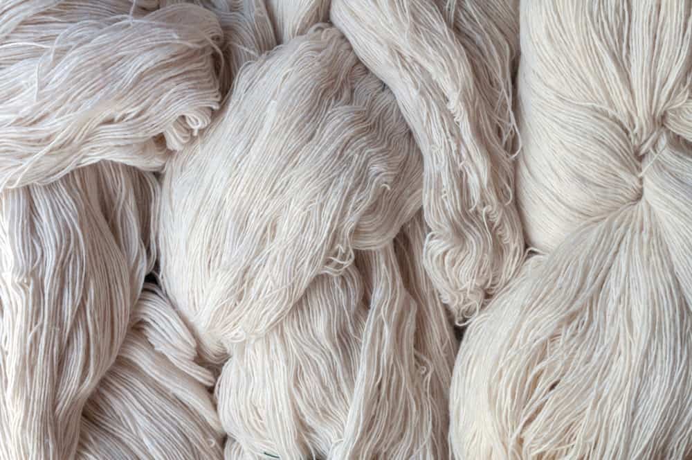 A close look at clumps of white cotton yarn.
