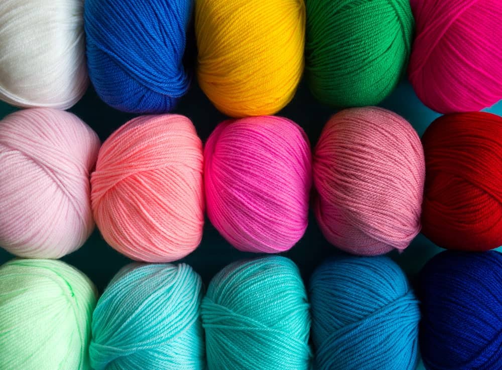Balls of colorful acrylic yarn.