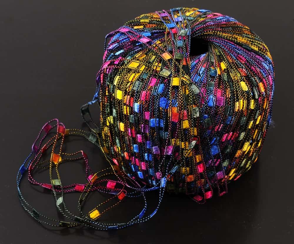 A ball of railroad ribbon yarn for knitting.