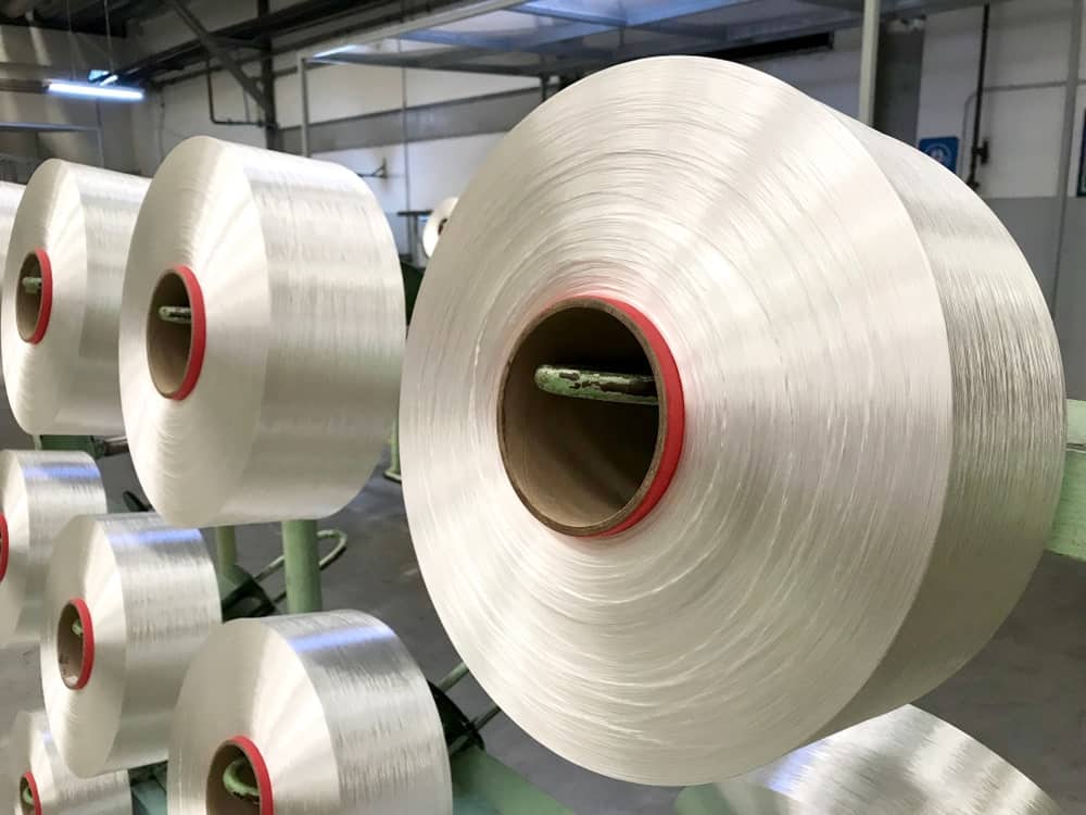 Large rolls of polyester yarn.