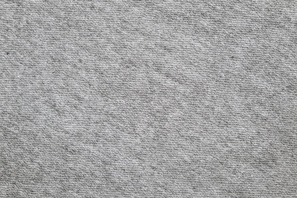 A close look at a gray polyester blend twill pattern.