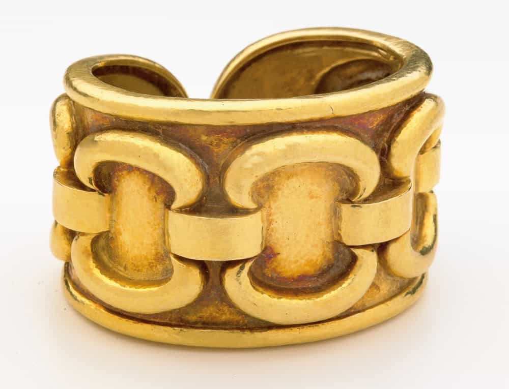 This is a close look at a golden cuff bracelet.
