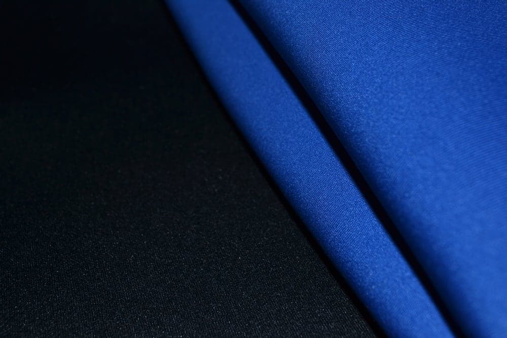 This is a close look at blue and black Neoprene Rubber fabrics.