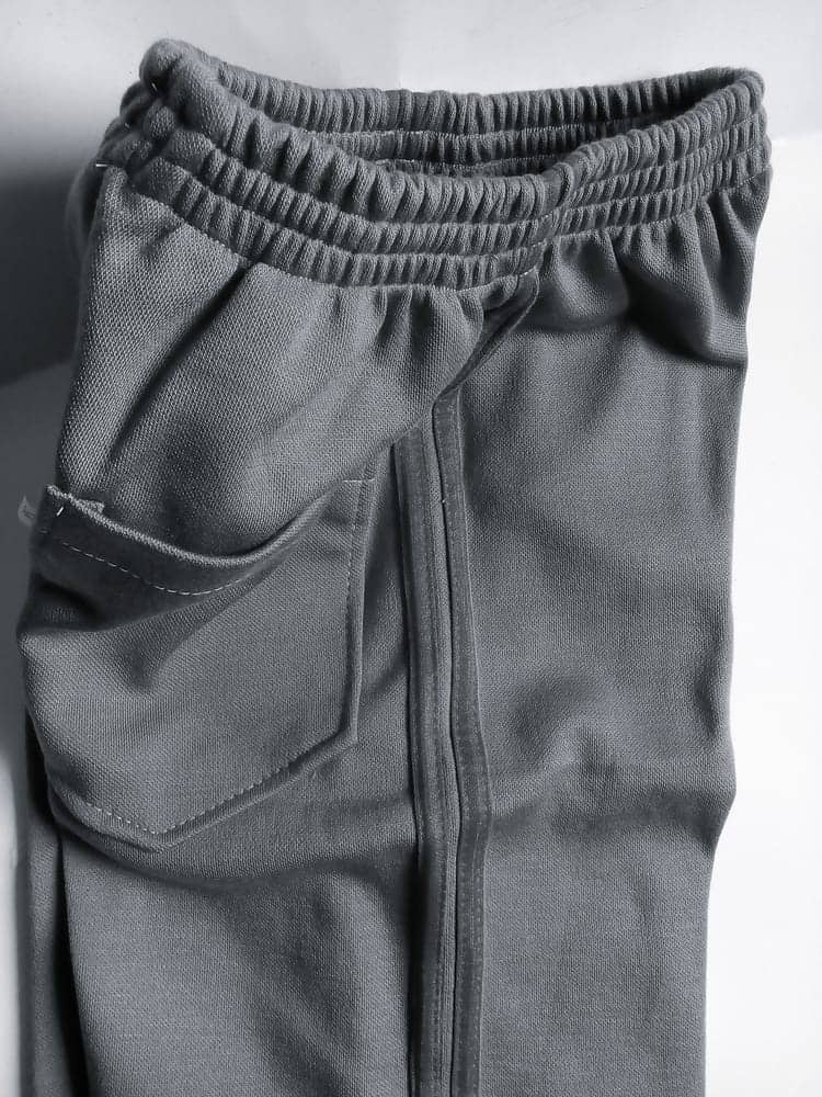 A close look at a pair of gray stretch denim pants.