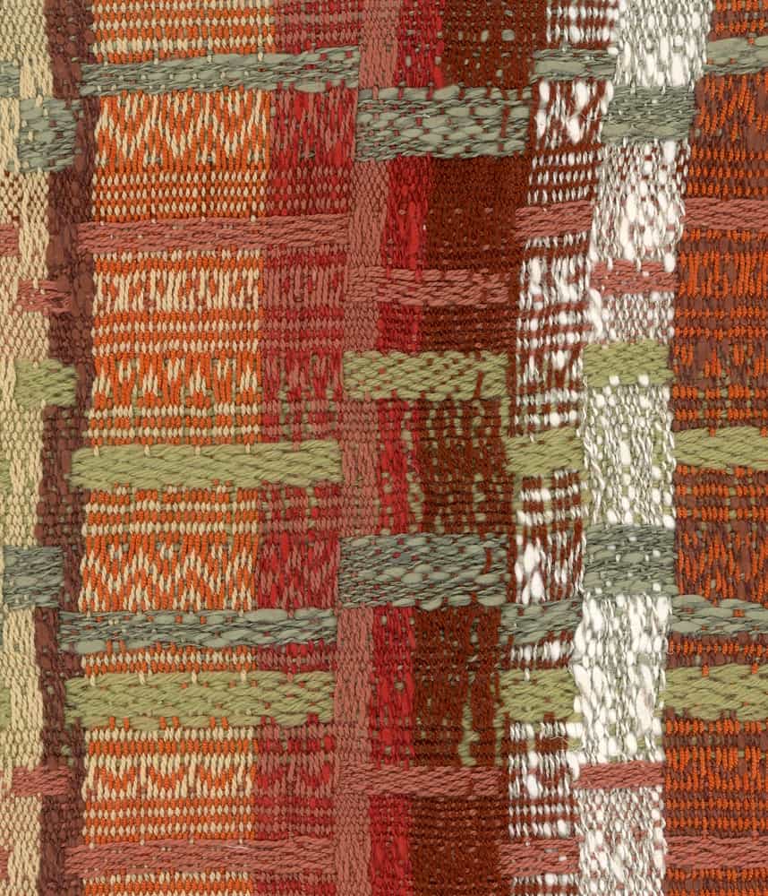 A close look at a colorful patterned cloth that has dobby weave.