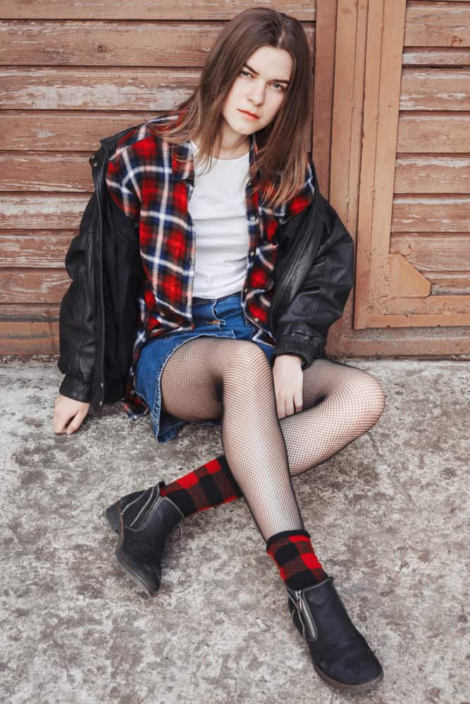 Woman in a grunge style outfit.