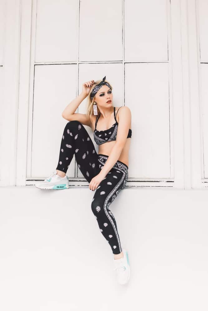 Model wearing a hip hop style outfit.