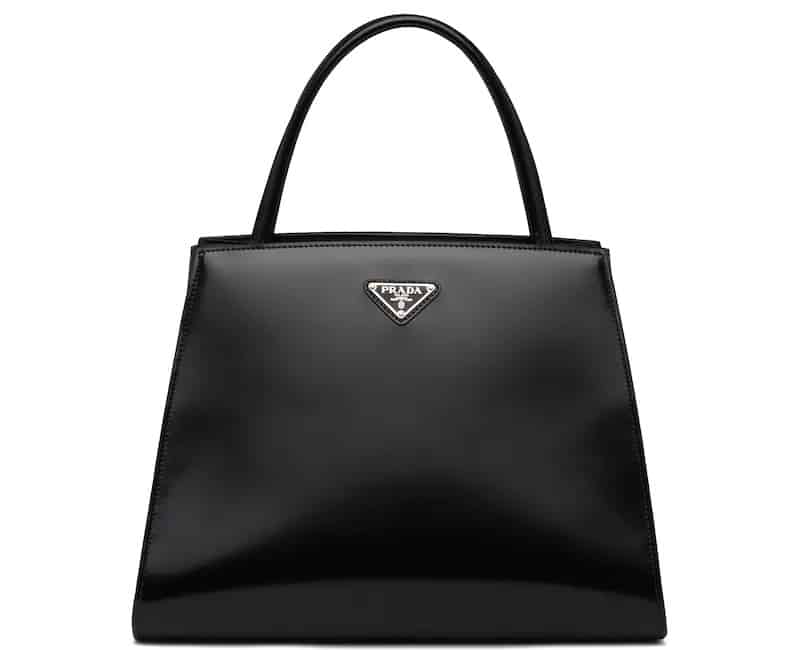 This is a black brushed leather handbag from Prada.