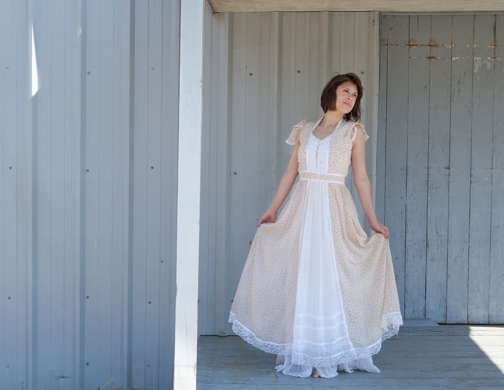 Woman wearing a prairie chic dress.