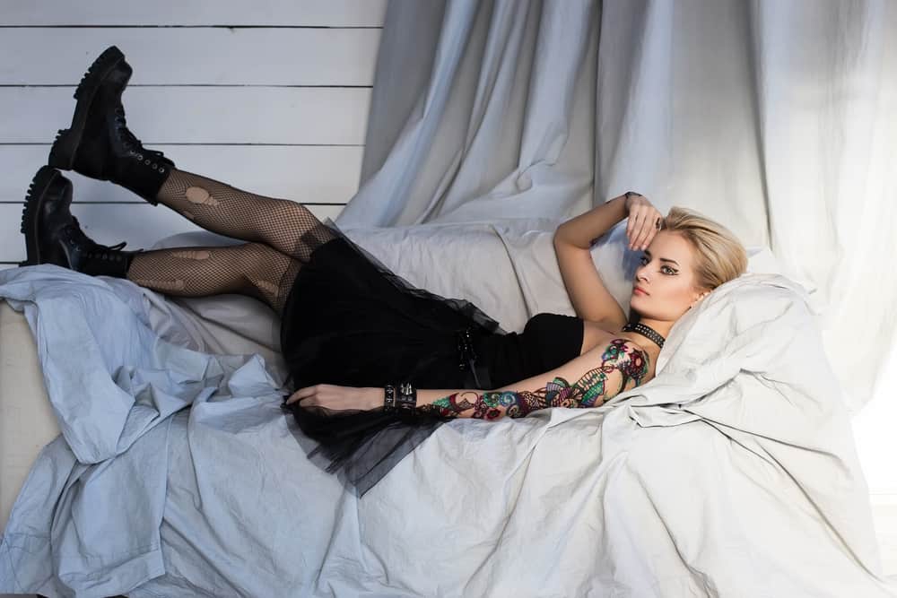 Punk girl lying on a sofa.