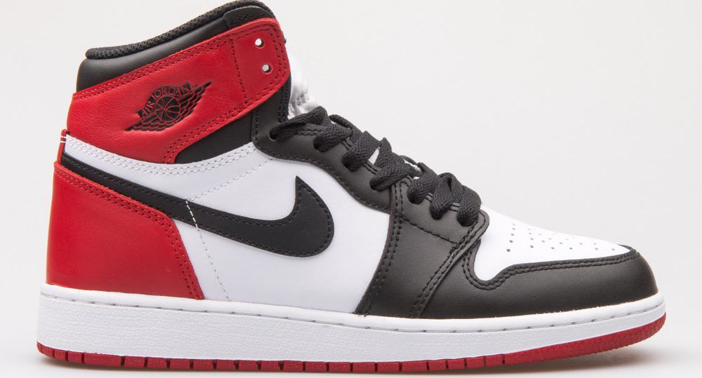 This is a close look at a Nike Air Jordan 1 Retro High OG BG white, black and red sneaker.