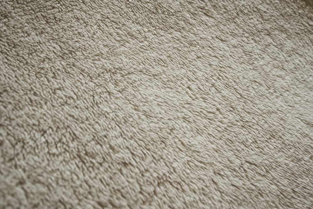 This is a close look at a beige Micro-Fleece fabric.