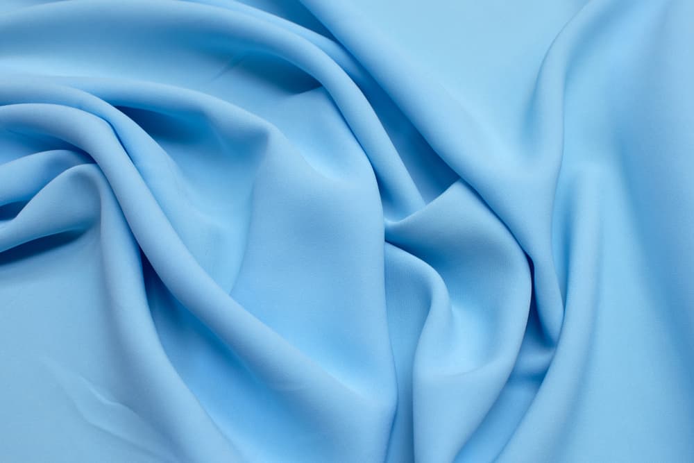 This is a close look at a light blue Rayon fabric.