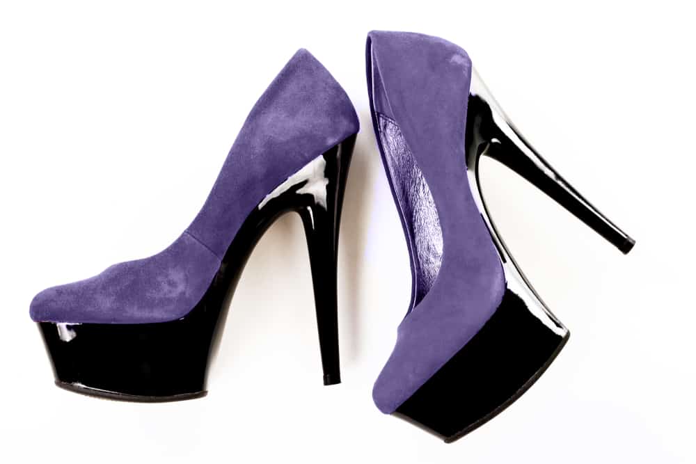 This is a close look at a pair of purple ultrasuede heels.