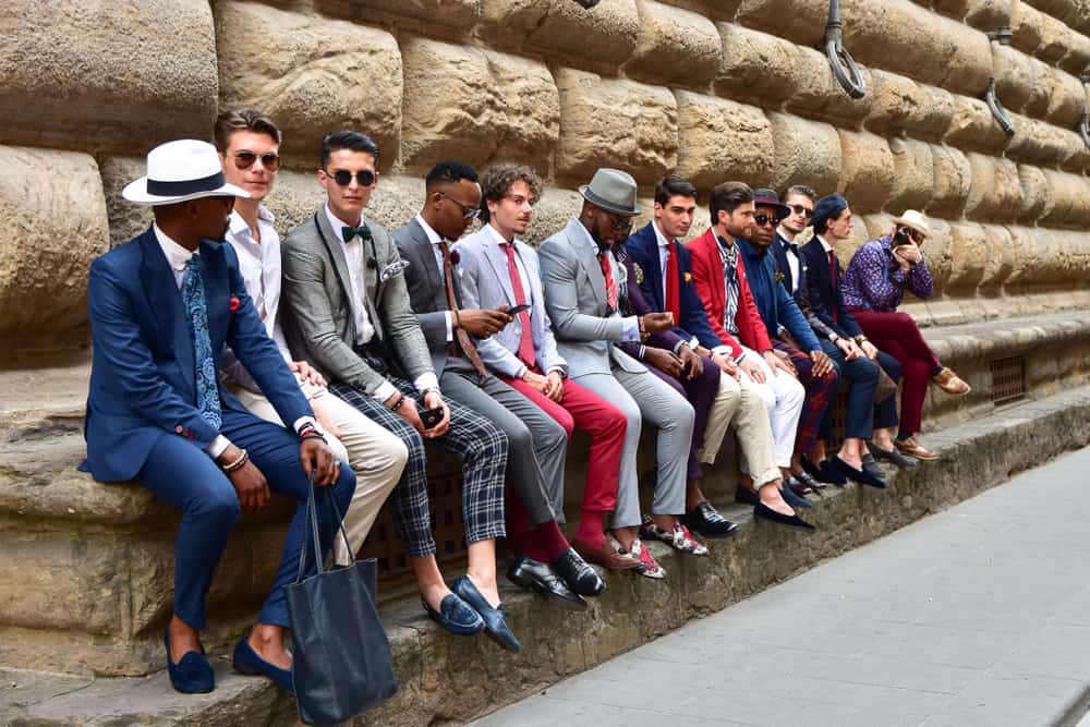 A group of men wearing fashionable outfits during fashion fair.