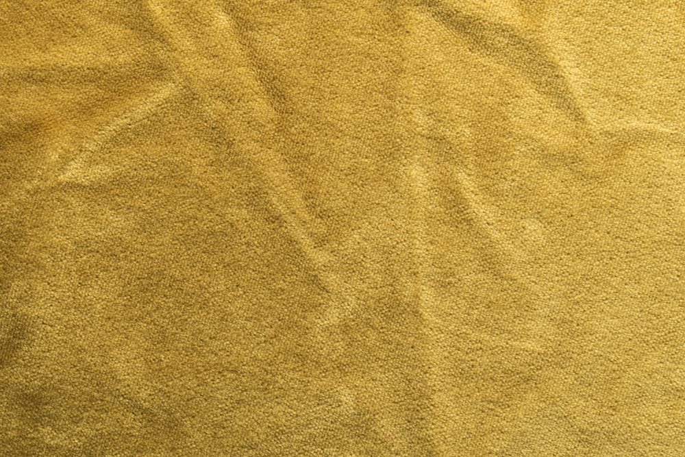 This is a close look at a golden mohair velvet fabric.
