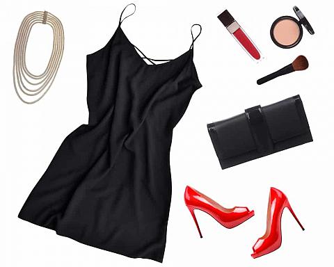 This is a close look at a little black dress surrounded by various accessories.