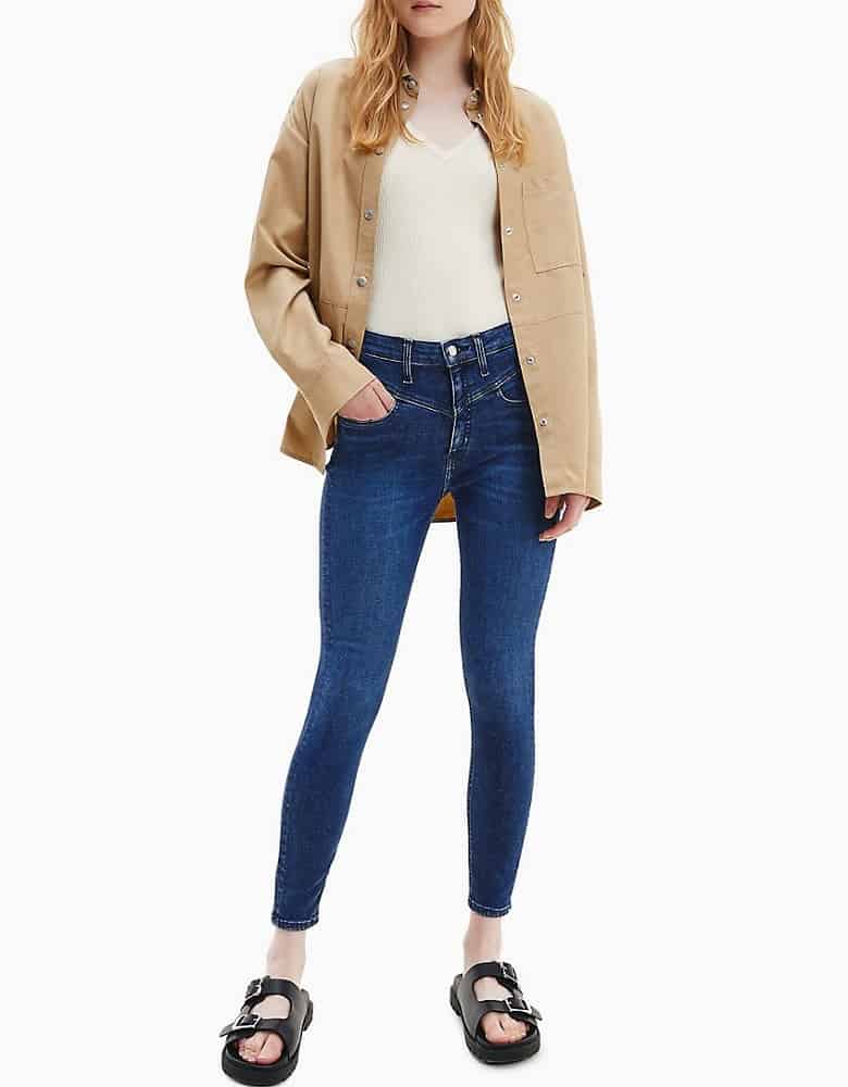 The High Rise Super Skinny Mid-Blue Ankle Jeans from Calvin Klein.