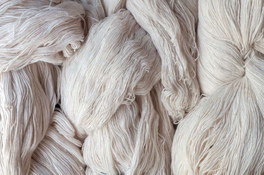 This is a close look at a bunch of raw yarn cotton materials.