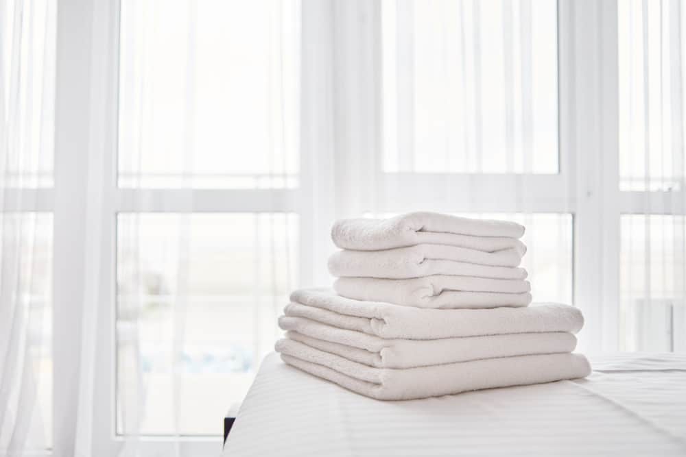 A look at a stack of cotton white towels.
