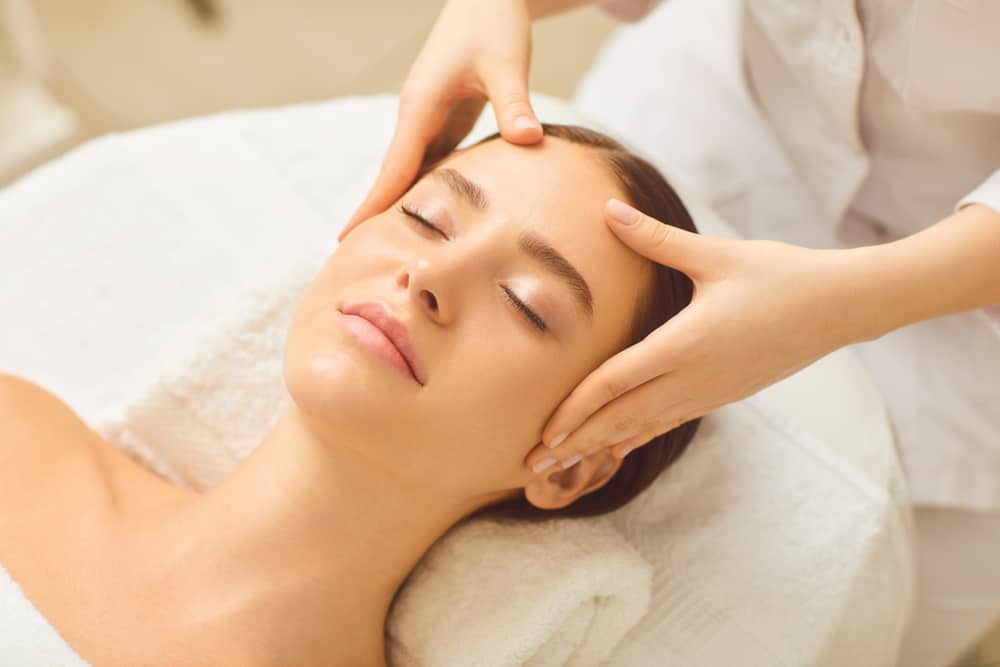 Woman having a facial massage.