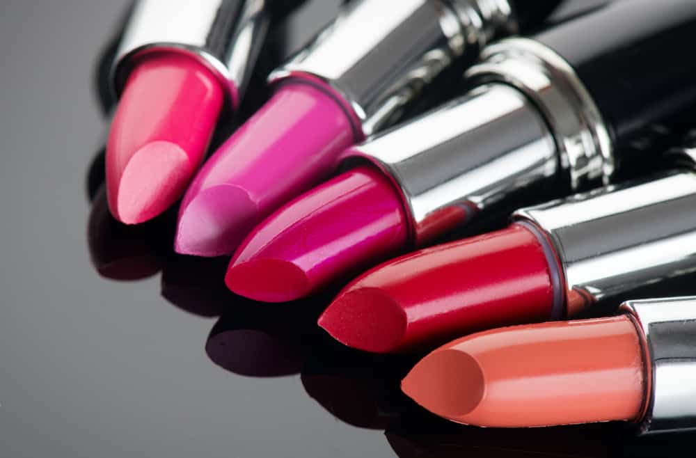 Lipstick tints palette against a black background.