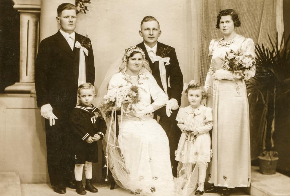 Vintage photo of newlyweds with the family.