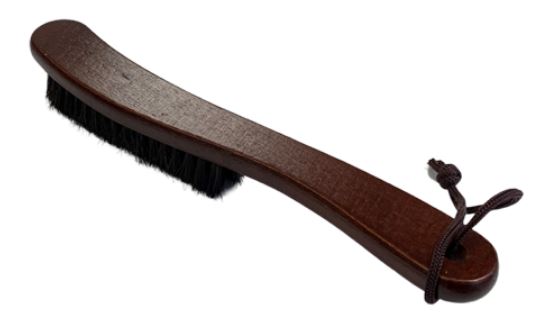 A fedora hat brush with wooden handle.
