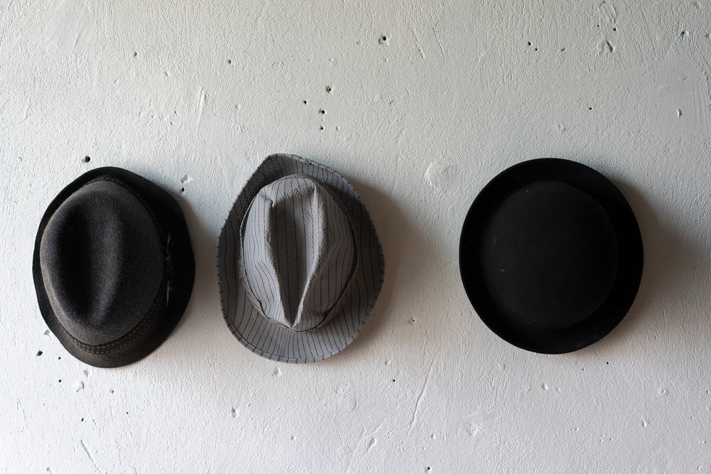 A close look at a bowler hat, a fedora hat and a trilby hat.