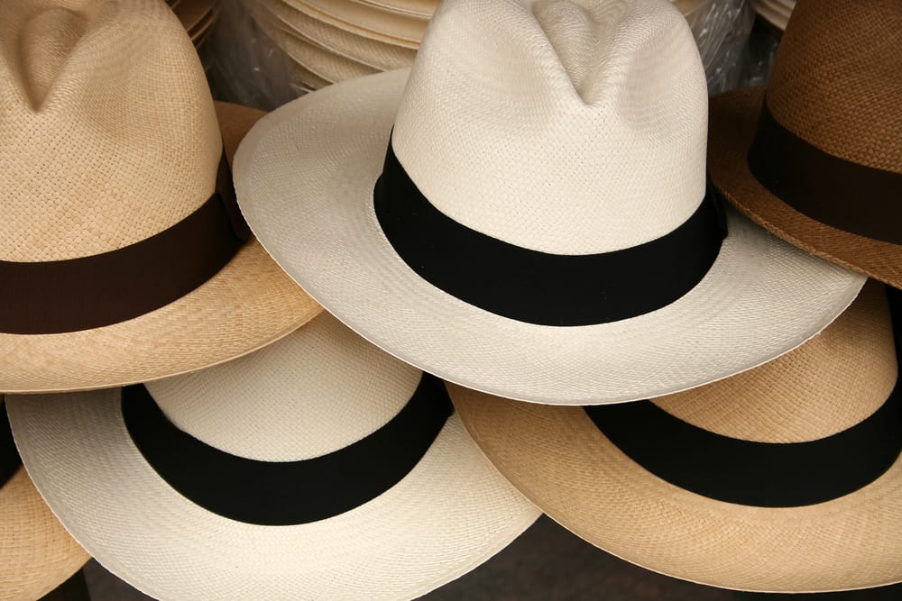 A close look at various panama hats on display.