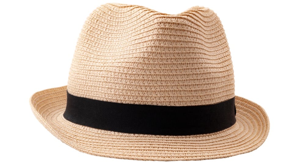 This is a beige straw woven fedora hat with a black band.