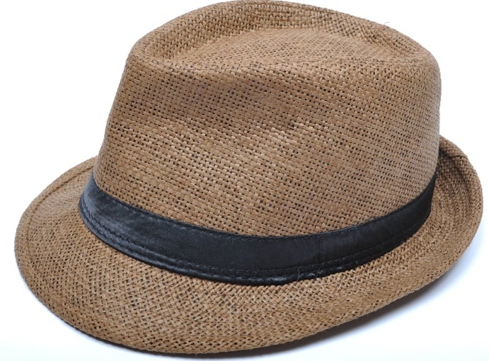 This is a brown woven trilby hat with black leather band.