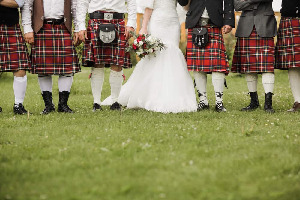A close look at the bride and grooms men at a traditional Scottish wedding.