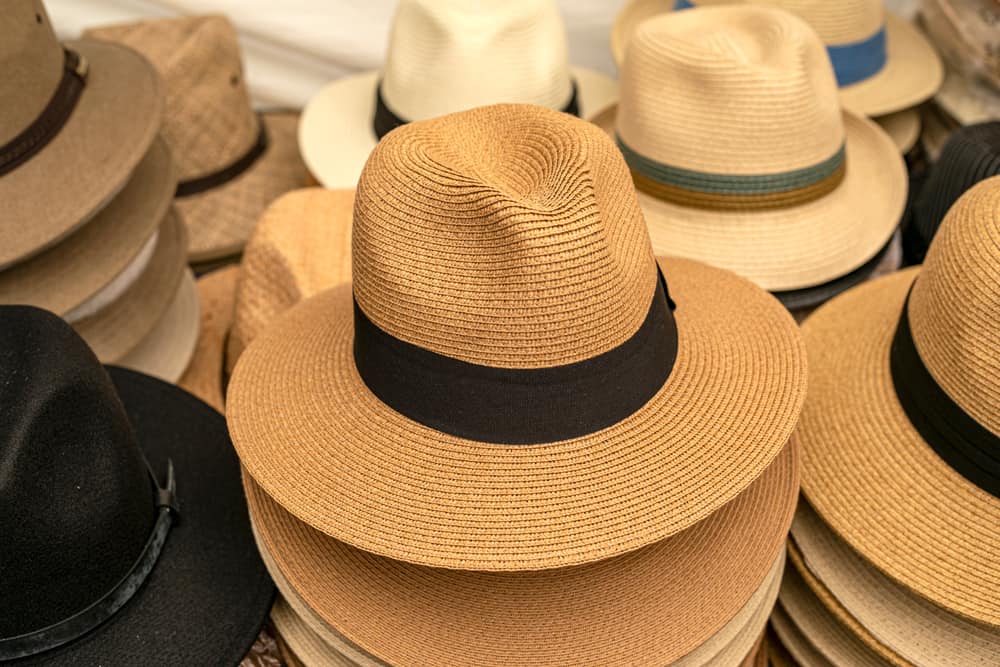 Various panama hats on display for sale.