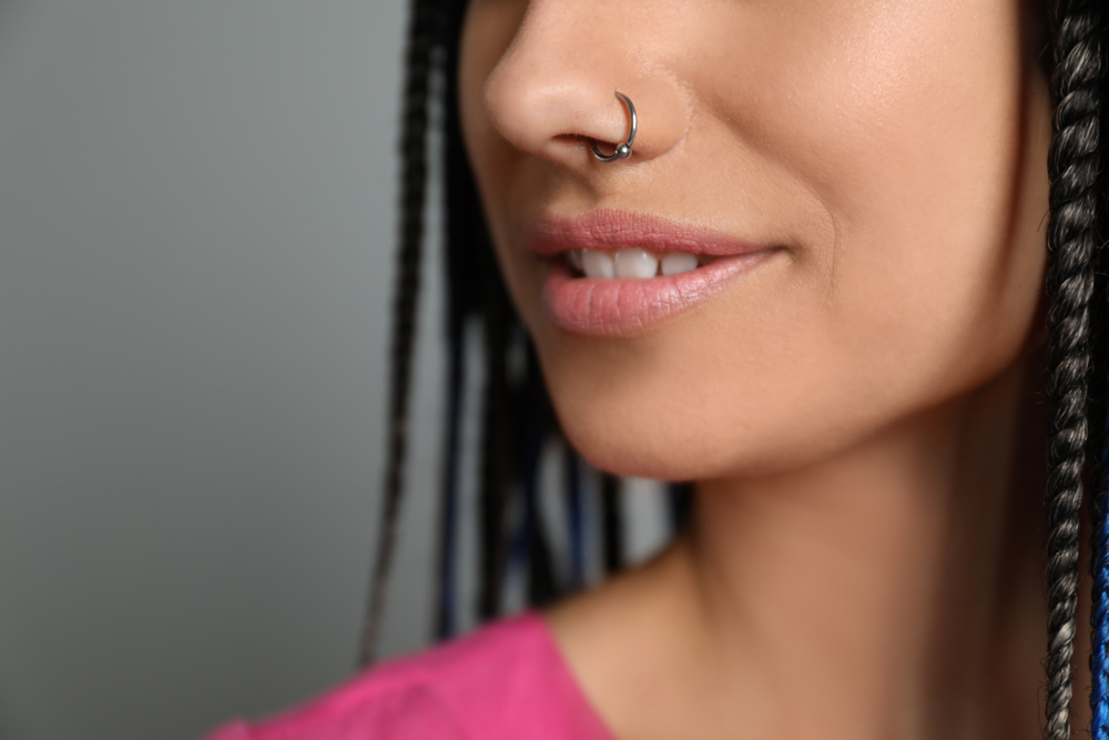 Close up of a nose ring on a smiling face