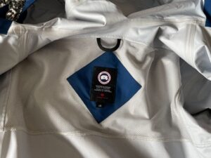 Inside venting and tag of Canada Goose rain jacket